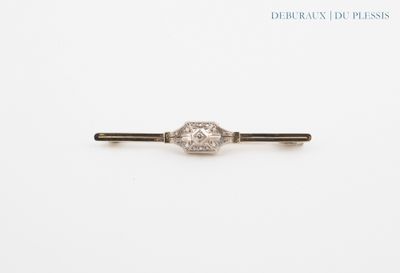 a close up of a diamond ring on a white surface