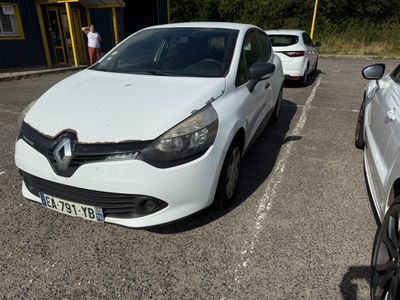 a white car parked in a parking lot next to a white car