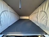 an image of the inside of a camper with a mattress