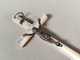 a cross with a jesus on it on a table