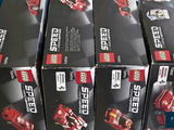 several boxes of lego speed cars are stacked on top of each other
