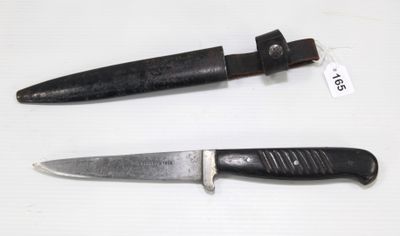 two knives that are on a table with a price tag