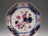 a plate with a dog and flowers on it
