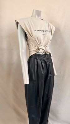 black leather pants with a white top and a white shirt on a mannequin mannequin mannequin mannequin mannequin mannequin mann