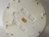 a close up of a white plate with wires on it