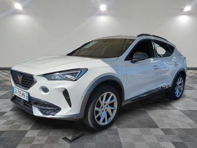 a white car parked in a room with a checkered floor