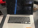 a laptop computer sitting on a desk with a price tag on it