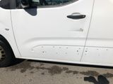 a white van parked on the side of the road