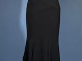 a black and white dress on a mannequin on a blue background