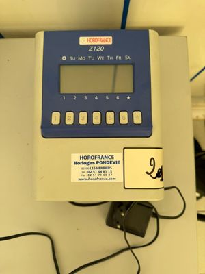 a blue and white electronic device sitting on a table