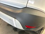 a close up of a car ' s bumper with a sticker on it