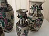 three vases that are sitting on a table