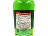 the back of a bottle of green liquid sitting on a white surface