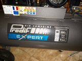 an air compressor sitting on the floor in the room