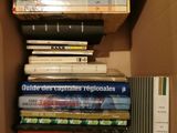 a box full of books that are stacked on top of each other
