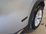 a close up of a tire on the side of a car