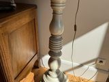 a lamp that is on top of a wooden table