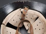 a close up of a helmet with a strap on it