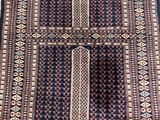a close up of a rug on a wooden floor