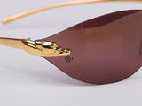 a close up of a pair of sunglasses on a white surface