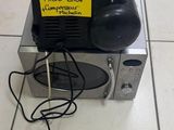a small machine that is sitting on a tiled floor