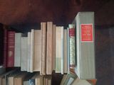 a lot of books that are sitting on a table
