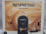 un carton de machines à café Nespresso Vertuo Plus