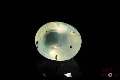 an image of a glass ball on a black surface