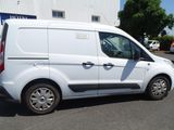 a white van that is parked in a parking lot