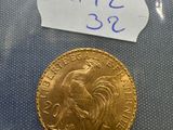 a gold sovereign coin with a label on it