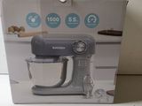 the box of a kitchen aid mixer is open on the counter