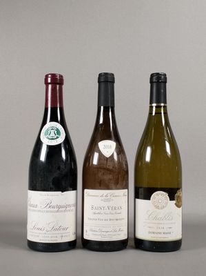 three bottles of wine sitting next to each other on a table