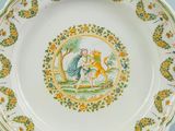 a plate with a picture of a man and a woman on it