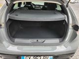 the back of a car with its trunk open on the side of the road