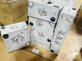 four boxes stacked on top of each other on the floor