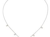 a silver necklace with a yellow stone on a chain