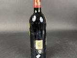 a bottle of wine that is sitting on a table