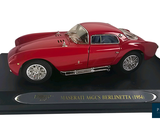 a red model of a sports car on a black base