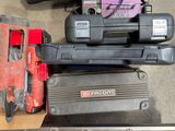 two tools that are sitting on top of a table