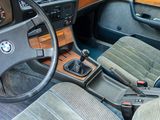 a dashboard and steering wheel of a car with a wood panel