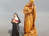 a statue of a nun and a statue of a man