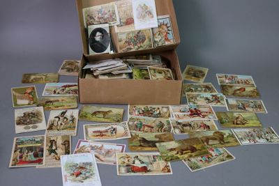 a box full of cards with pictures of people on them