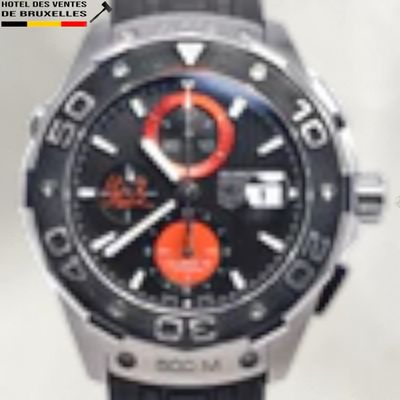 a close up of a watch on a white surface