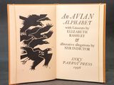 an open book with a picture of birds on it