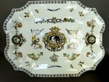 a decorative plate with a clock on it