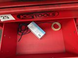 a red tool box with a box of tape and a box of tape