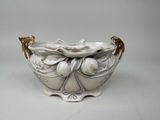 a white bowl with a gold decoration on it
