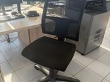 a computer desk with two monitors and a chair in front of it