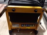 a yellow cart with a black bag on top of it