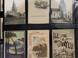 many old postcards on display on the wall
